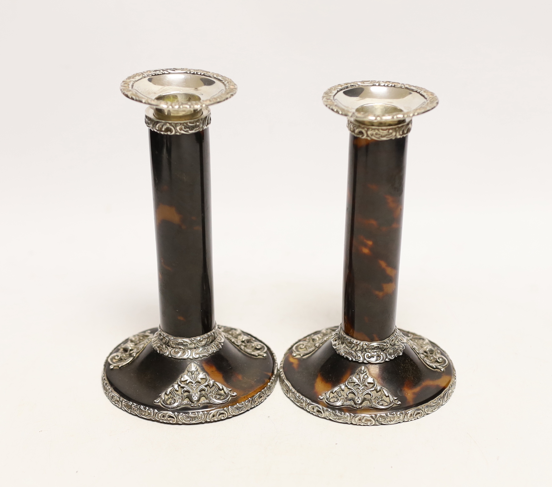 A pair of Edwardian pieced silver mounted tortoiseshell candlesticks, J. Batson & Son, London, 1902, height 16.4cm.